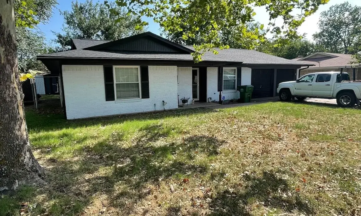 Professional roofing crew working on a residential roof in Parma Heights